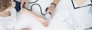 Doctor measuring patient's blood pressure