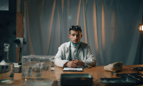 male-psychiatrist-at-the-table-mental-hospital-VW97MAY